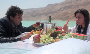 videostill by Ben Hertzog out of the video performance project "Salt Dinner" by Shahar Marcus and Nezaket Ekici.